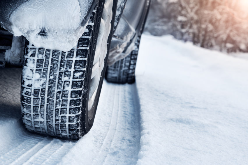 Winter tires on a road covered in snow