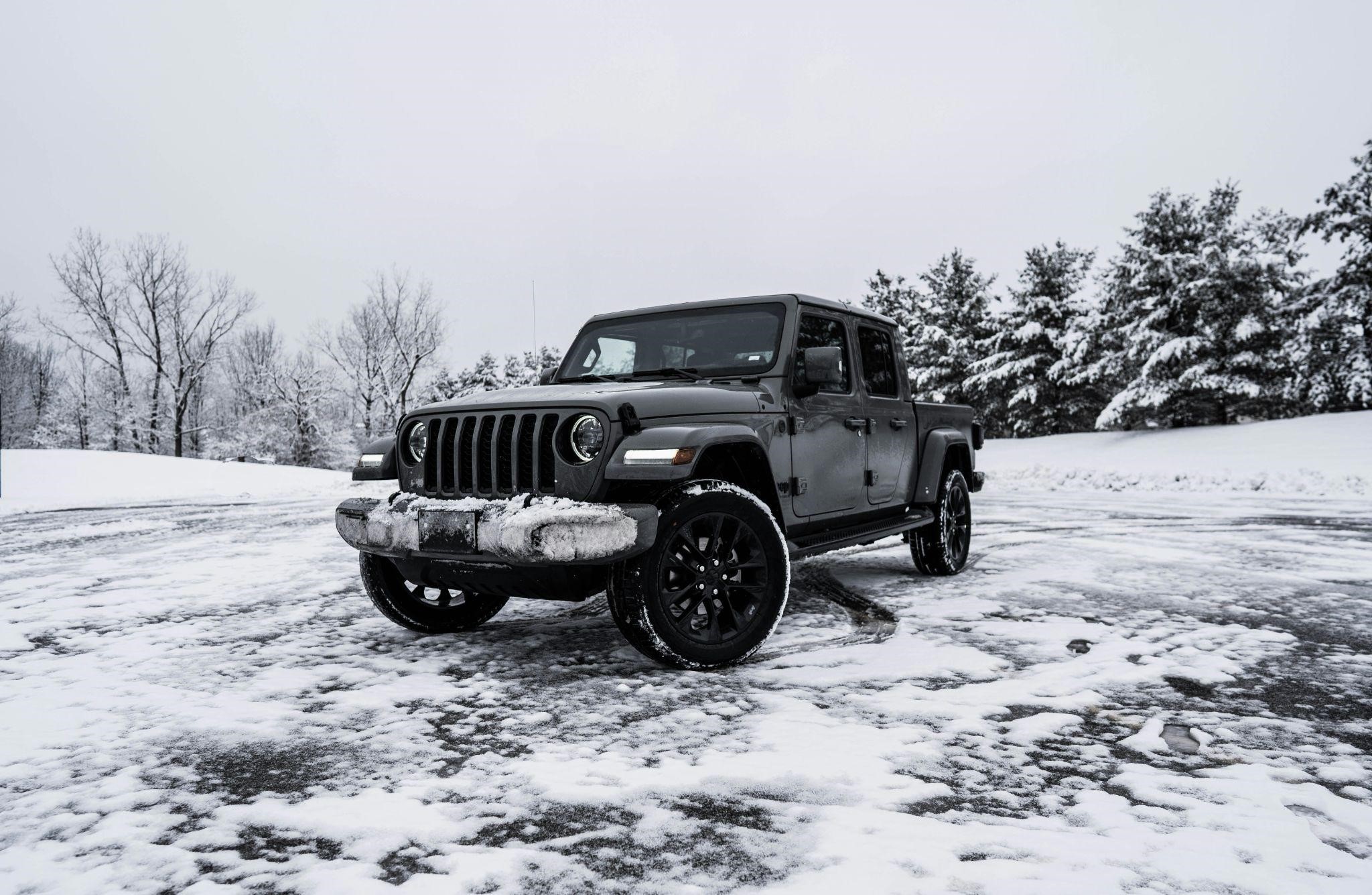 Studded vs Non-Studded Winter Tires Truck driving on snowy road equipped with winter tires for traction and safety - Tires Easy