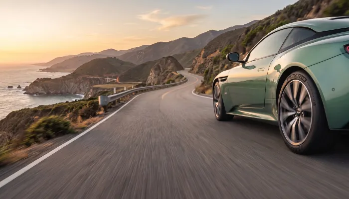 Luxury sports coupe driving smoothly on a highway highlighting tire acoustic comfort and daily drivability.