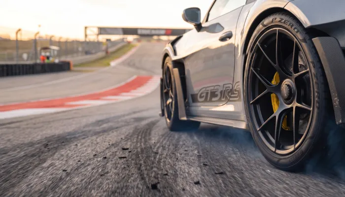 Pirelli P Zero high-performance tire mounted on a luxury sports car.