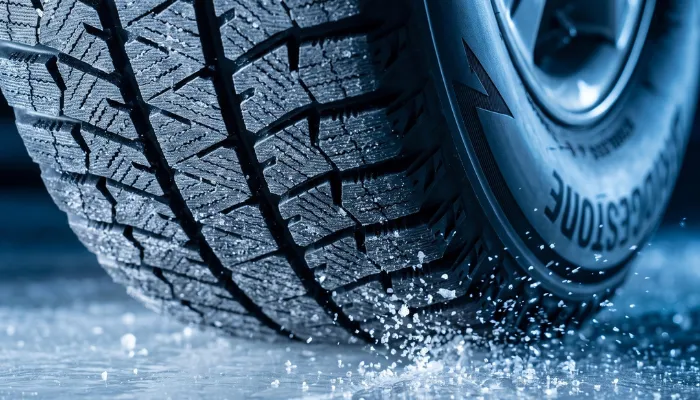 Blizzak WS90 directional tread pattern with full-depth sipes gripping glaze ice.